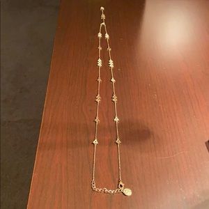 Gold tone Y necklace with crystal stones